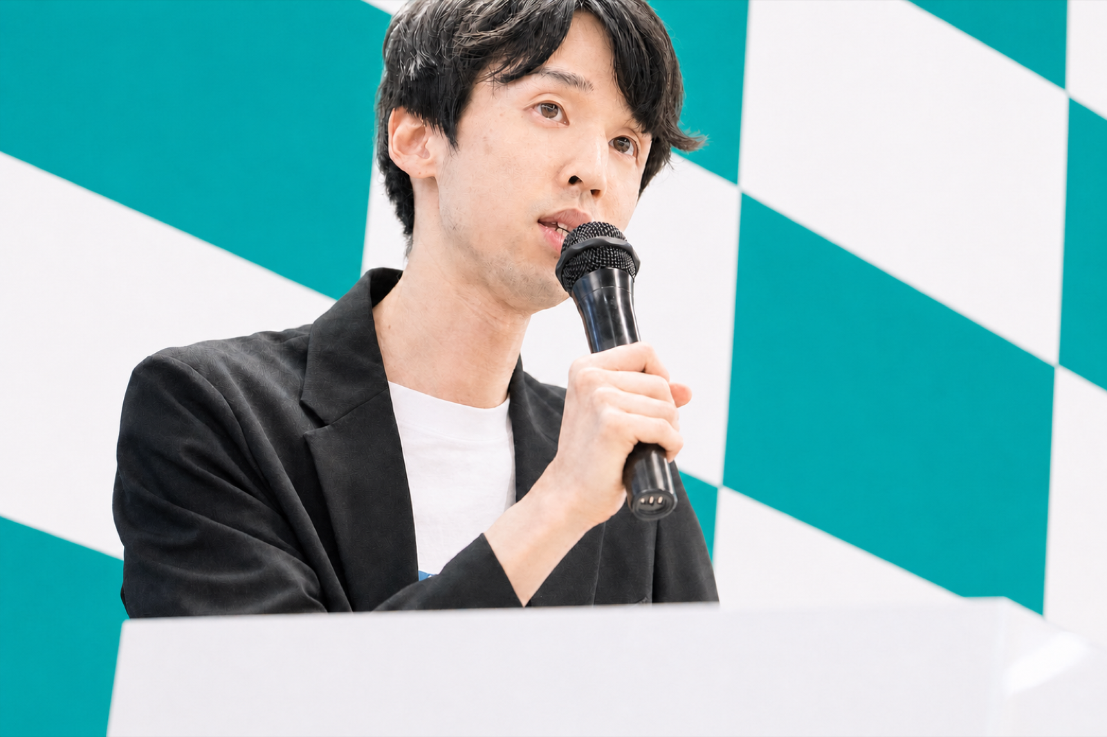 講演する川合卓也